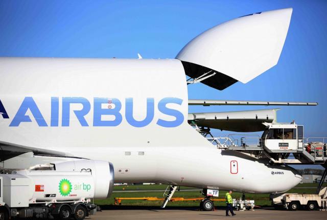 An Airbus A300 Beluga aircraft is loaded with wings at the Airbus SAS wing assembly factory on November 7, 2013 in Broughton, United Kingdom. An Airbus A300 Beluga aircraft is loaded with wings at the Airbus SAS wing assembly factory on November 7, 2013 in Broughton, United Kingdom.