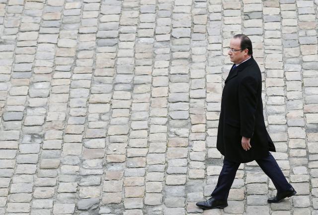 French President Francois Hollande reviews the troops upon arrival at a military ceremony in the courtyard of the Invalides on November 26, 2013 in Paris, France. French President Francois Hollande reviews the troops upon arrival at a military ceremony in the courtyard of the Invalides on November 26, 2013 in Paris, France.